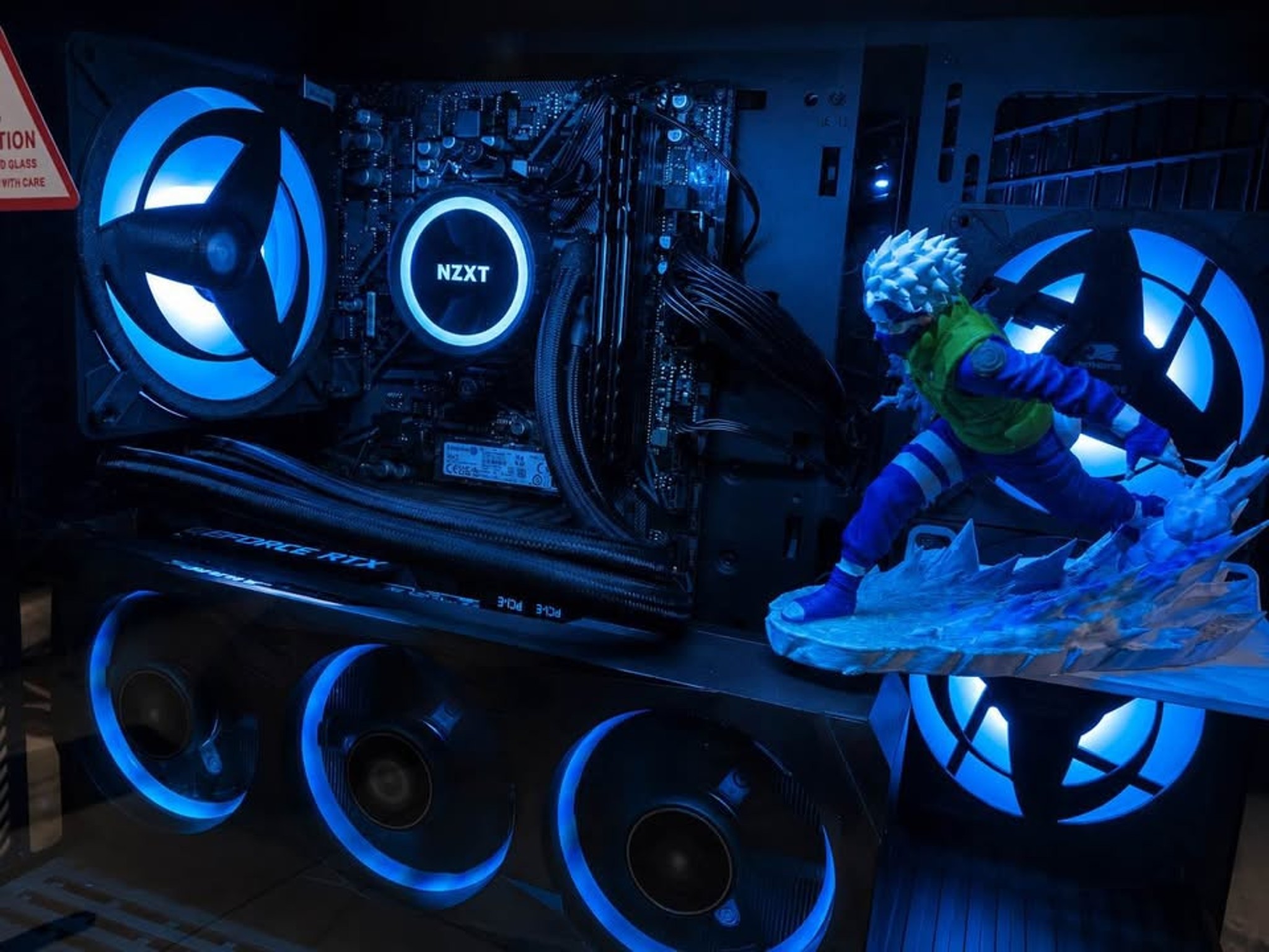 Inside the Robust Tech Kakashi build, showing its graphics card, liquid cooler and blue lighting